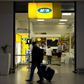 Travellers walk past an MTN telecom shop at King Shaka International Airport in Durban, South Africa, November 16, 2015. REUTERS/Rogan Ward