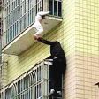 Strangers save child found dangling by its neck from 3rd floor balcony