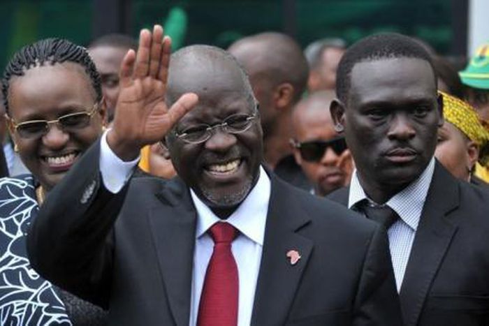 Tanzania"s President elect John Pombe Magufuli salutes members of the ruling Chama Cha Mapinduzi Party (CCM) at the party"s sub-head office on Lumumba road in Dar es Salaam, October 30, 2015.