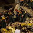 Workers trapped in collapsed Pakistan factory plead for help on mobile phones