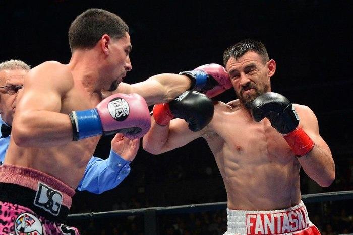 Danny Garcia (pink shorts) battles Robert Guerrero (red shorts) during their WBC welterweight boxing title fight at Staples Center. Garcia won by decision. Mandatory Credit: Jayne Kamin-Oncea-USA TODAY Sports