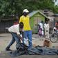 A body bag is laid out to collect human remains at the site of an explosion in Maiduguri, northeast Borno State in Nigeria, on October 12, 2016 which killed eight people