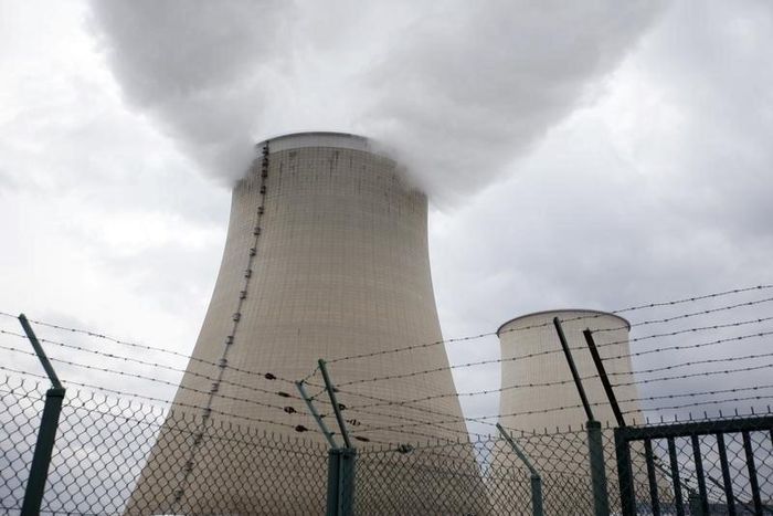 Steam rises from the cooling towers a nuclear power station in a file photo. REUTERS/Charles Platiau