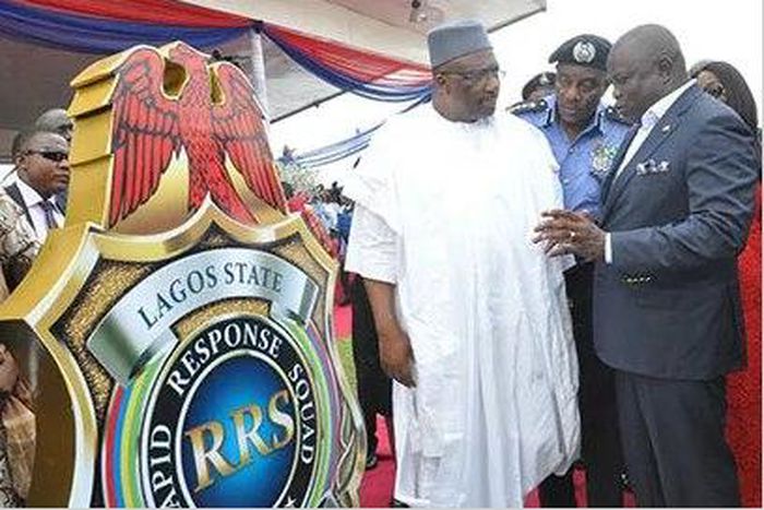 Governor Akinwunmi Ambode; Inspector General of Police, Mr. Solomon Arase and Minister for Interior, Lt.Gen.Abdulrahman Dambazua (rtd.), during the unveiling of Rapid Response Squad (RRS) logo at the commissioning and handing over  of patrol vehicles e...