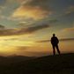 Male silhouette watching the rising sun