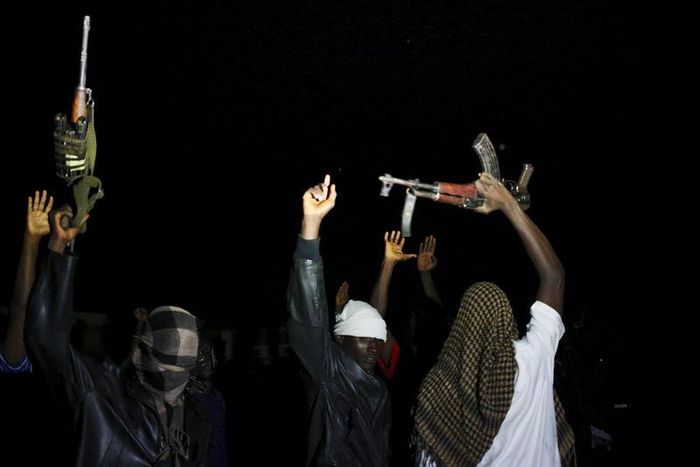 Armed vigilantes holds AK-47 before they patrol in the center of Bujumbura, Burundi, November 20, 2015. Picture taken November 20, 2015. REUTERS/Goran Tomasevic
