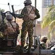 Burkina Faso troops try to disperse protesters in Ouagadougou on 30 October 2014.