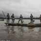 Cameroonian artisanal miners go diving in the Wouri river an average of 100 times a day for wet sand [Hugh Brown/SWNS.com]