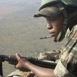 A female Cameroonian soldier stands guard at an observation post on a hill in the Mandara Mountain chain in Mabass, overlooking Nigeria, northern Cameroon, February 16, 2015. REUTERS/Bate Felix Tabi Tabe