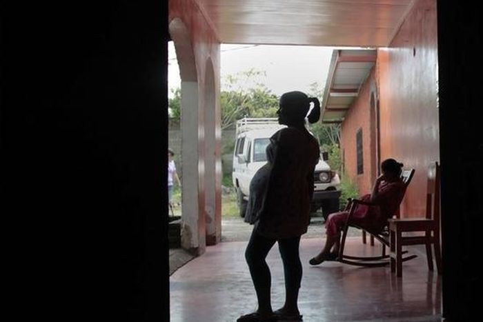 Pregnant teenagers stand at the entrance of a maternity home in Jinotega city, some 160 km (99 miles) north of Managua October 24, 2013. REUTERS/Oswaldo Rivas