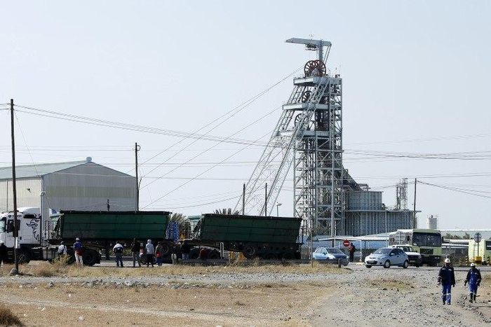 Workers leave Lonmin's Karee mine at the end of their shift, outside Rustenburg, northwest of Johannesburg July 29, 2015. REUTERS/Siphiwe Sibeko