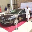 Kunle Afolayan with Peugeot 508