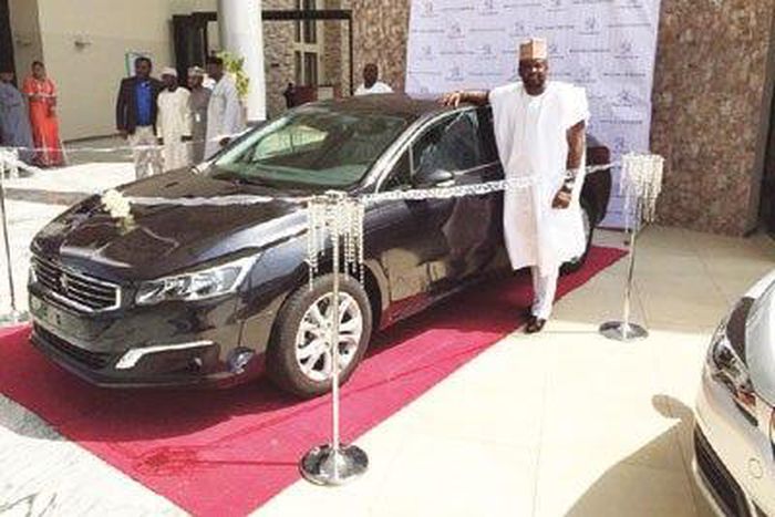 Kunle Afolayan with Peugeot 508