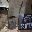 A signboard rests against a wall in a compound in Michika town, after the Nigerian military recaptured it from Boko Haram, in Adamawa state May 10, 2015.