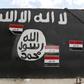 A wall painted with the black flag commonly used by Islamic State militants, near former Iraqi president Saddam Hussein's palace in Tikrit April 1, 2015.