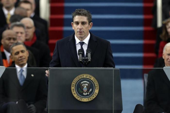 Poet Richard Blanco speaks at the U.S. Capitol in Washington during the inauguration for President Barack Obama, left, and Vice President Joe Biden right.