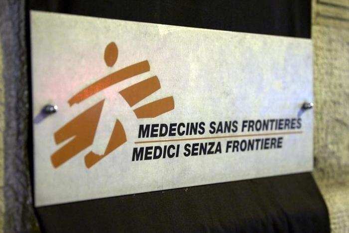 A sign is pictured over a black sheet outside the Medecins Sans Frontieres (MSF) headquarters in Geneva, Switzerland October 7, 2015. REUTERS/Denis Balibouse