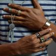 Denola Grey wearing a silver necklace