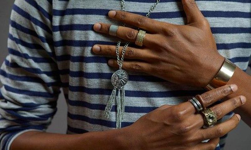 Denola Grey wearing a silver necklace