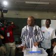 Presidential candidate Roch Marc Kabore (c) votes during the presidential and legislative election at a polling station in Ouagadougou, Burkina Faso, November 29, 2015. REUTERS/Joe Penney