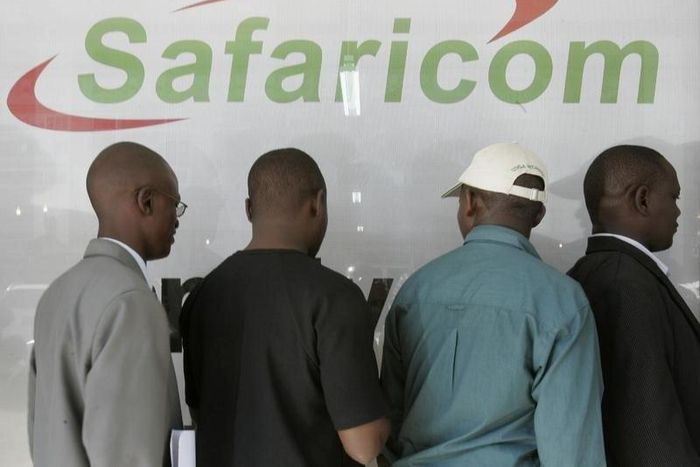 Kenyans line up outside a Safaricom building in a file photo. REUTERS/Antony Njuguna