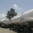 Trucks transporting oil, petrol and gas wait to reload outside a depot in the outskirts of Nairobi September 30, 2008.   REUTERS/Antony Njuguna