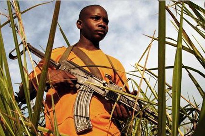 African holding a gun