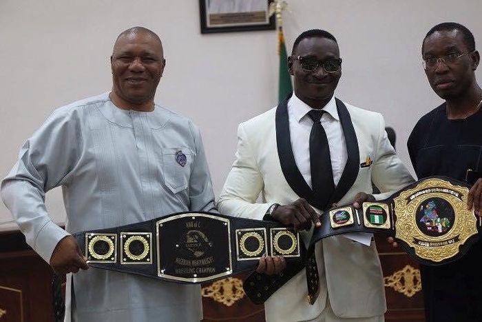 Isoko born African Wrestling Champion, Power Lee presents Medals to Governor Okowa