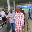 Transport Minister, Rotimi Amaechi takes off shoes at Murtala Mohammed International Airport on December 3, 2015