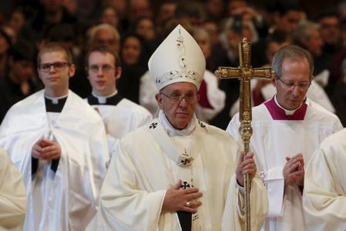 Pope Francis leaves after he leads a holy mass for the family in Saint Peter"s Basilica at the Vatican, December 27, 2015.