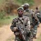Democratic Republic of Congo military (FARDC) personnel patrol against the Allied Democratic Forces (ADF) and the National Army for the Liberation of Uganda (NALU) rebels near Beni in North-Kivu province, December 31, 2013. REUTERS/Kenny Katombe