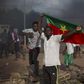 An anti-coup protester holds a Burkinabe flag in Ouagadougou, Burkina Faso, September 18, 2015. REUTERS/Joe Penney