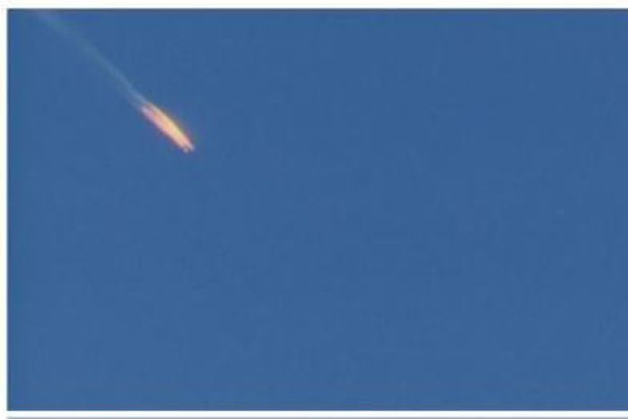 A war plane crashing in flames in a mountainous area in northern Syria after it was shot down by Turkish fighter jets near the Turkish-Syrian border, is seen in this still image taken from video November 24, 2015.