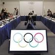 International Olympic Committee President Jacques Rogge and members of the IOC talk prior to the beginning of the IOC executive board meeting at the SportAccord convention at the Congress Center in Quebec City, in a file photo. REUTERS/Mathieu Belanger
