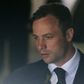 South African Olympic and Paralympic sprinter Oscar Pistorius is led to a prison van after his sentencing in Pretoria October 21, 2014. REUTERS/Mike Hutchings