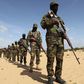 Members of Somalia's Al Shabaab militant group parade during a demonstration to announce their integration with al Qaeda, in Elasha, south of the capital Mogadishu February 13, 2012. REUTERS/Feisal Omar