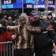 A woman is searched by a New York Police Department officer as she enters a pen to wait for the beginning.