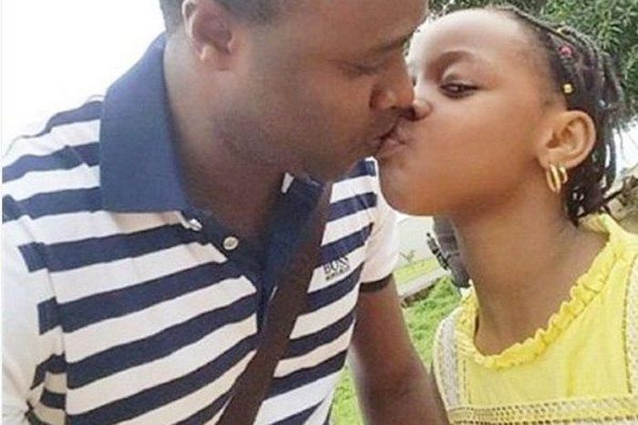 Femi Adebayo kissing his daughter