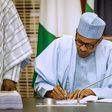 President Muhammadu Buhari signing the 2019 Budget into Law at the State House; 27th May 2019. (Twitter/Aso Rock)