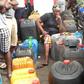 A woman waits in a queue in Lagos, a dejected look on her face as she mulls over the fuel crises.