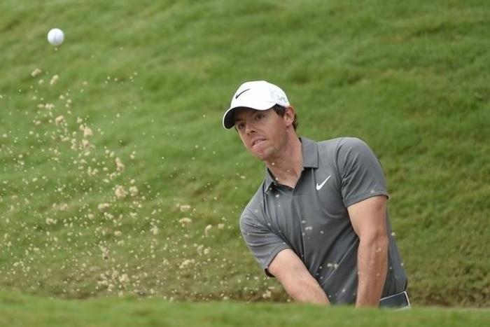 Rory McIlroy chips onto the second green during the final round of the Tour Championship by Coca-Cola at East Lake Golf Club. Mandatory Credit: John David Mercer-USA TODAY Sports