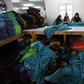 Labourers work at a textile mill in Mahalla el-Kubra, about 110 km north of Cairo March 5, 2014. REUTERS/Mohamed Abd El Ghany