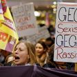 Women shout slogans and hold up a placard that reads 'Against Sexism - Against Racism' as they march through the main railways station of Cologne, Germany, January 5, 2016.