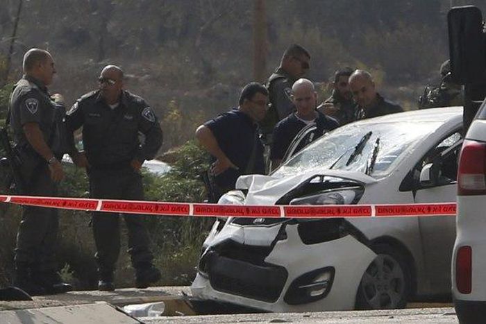 Palestinian rams car into Israelis, then shot dead -police