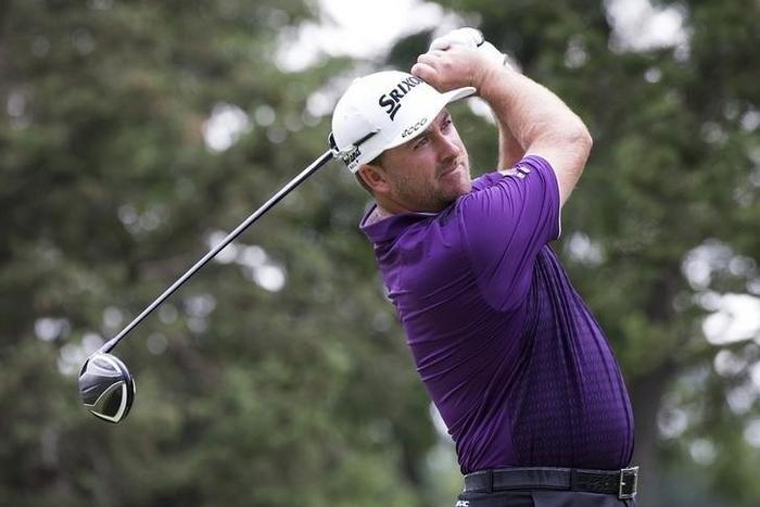 Aug 8, 2015; Akron, OH, USA; Graeme McDowell tees off on the sixteenth hole at Firestone Country Club - South Course. Mandatory Credit: Greg Bartram-USA TODAY Sports