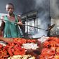 Tanzanian traders deep-fry freshly caught octopus near the shores of the commercial capital Dar es Salaam, May 4, 2010. REUTERS/Thomas Mukoya