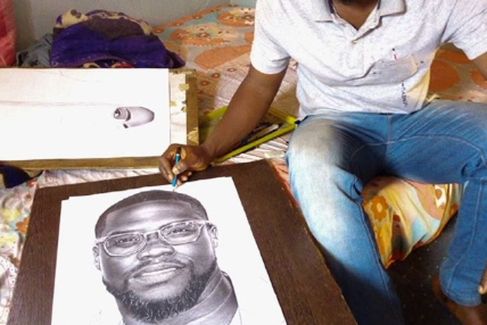 Eli Waduba with his drawing of Kevin Hart [Instagram/eliss_artss]