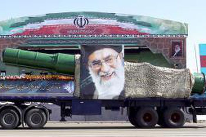 A military truck carrying a missile and a picture of Iran"s Supreme Leader Ayatollah Ali Khamenei is seen during a parade marking the anniversary of the Iran-Iraq war (1980-88) in Tehran, in this September 22, 2015 file photo.