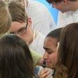 A picture of German Chancellor Angela Merkel consoling a 14-year-old Palestinian refugee-Reem Sahwil.