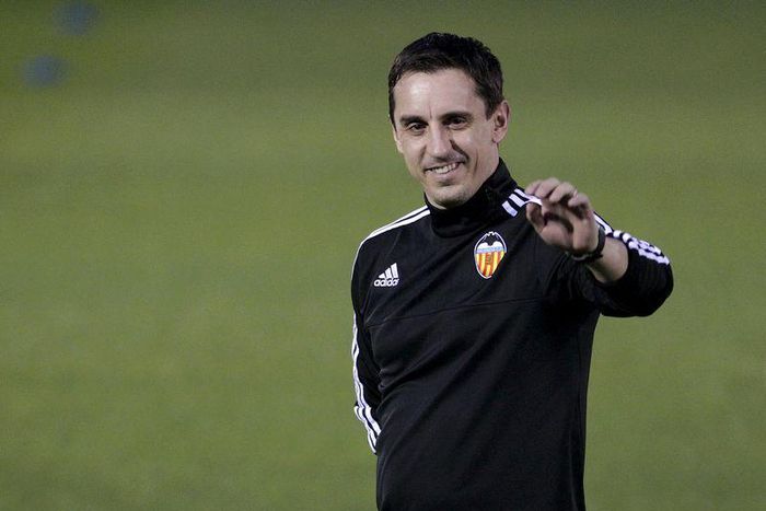 Valencia's new coach Gary Neville greets the public during his first training session in Valencia, Spain, December 7, 2015. REUTERS/Heino Kalis